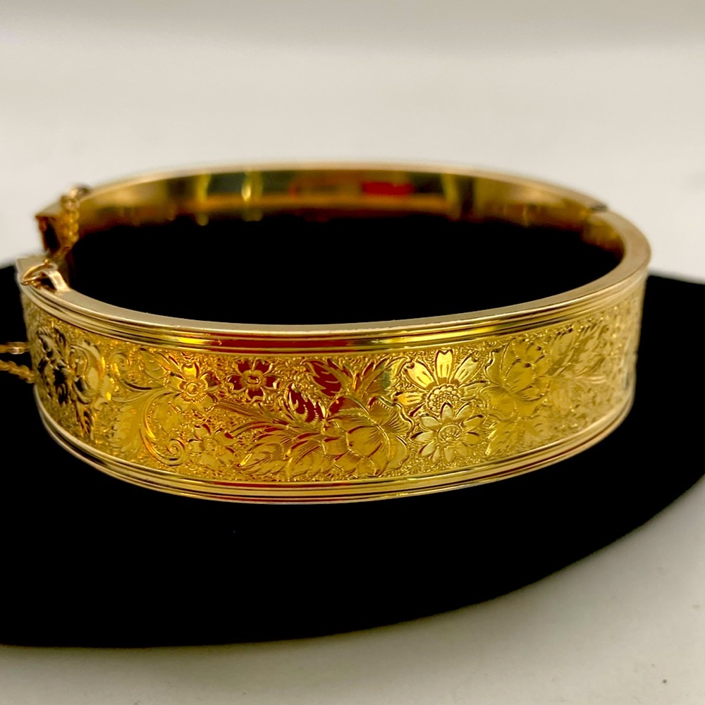 victorian hinged bangle bracelet. intricate floral design safety chain.